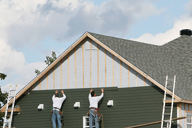 Professional Siding Contractor technician working in Wellington, CO